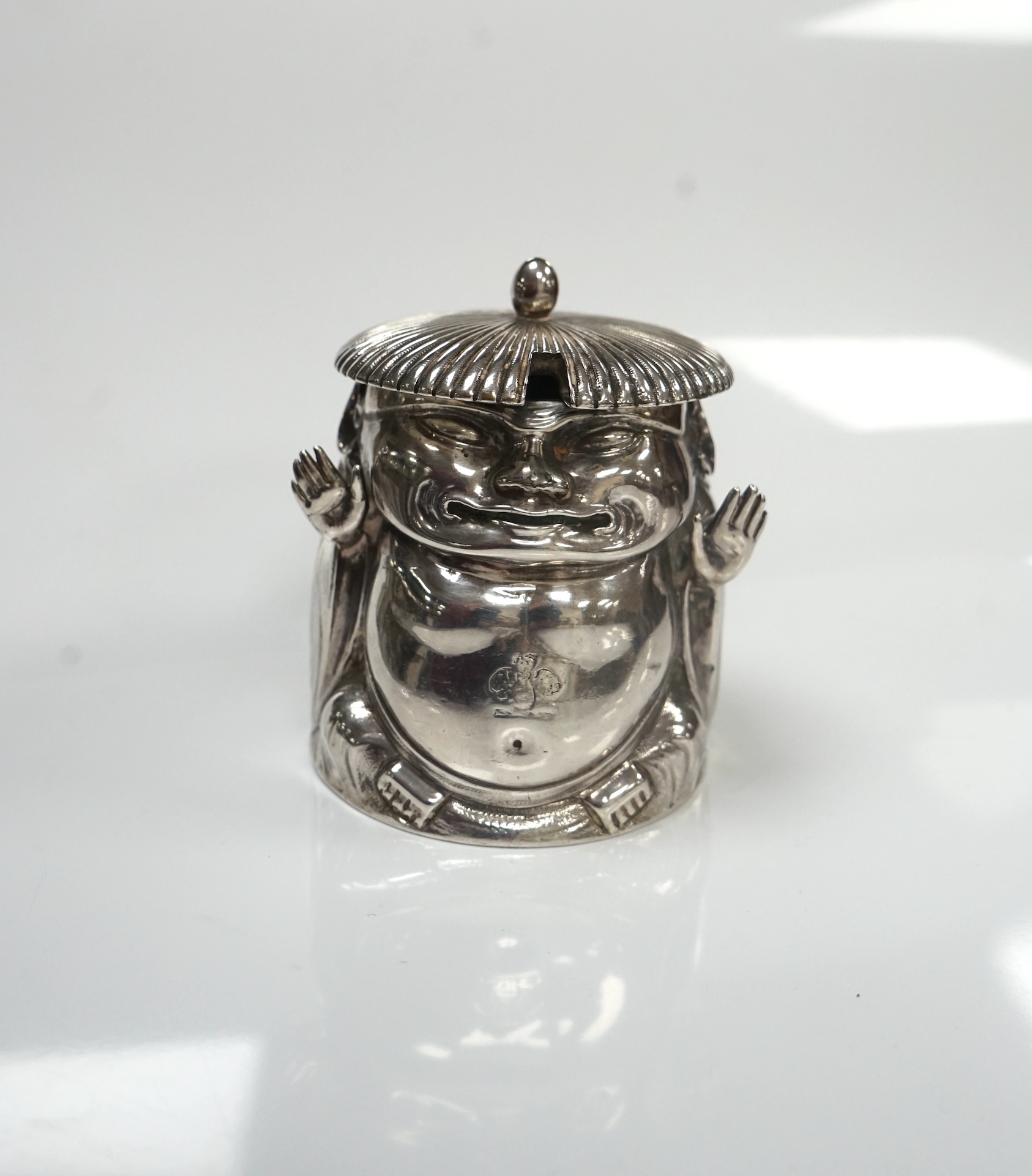 A Victorian novelty silver mustard, modelled as a Chinaman, with blue glass liner, by Richard Sibley II, London, 1847, height 85mm, 6.1oz. Condition - fair